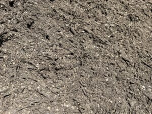 Top Dressing vs Turf Underlay Premium Turf Underlay – close-up of loose soil and small organic pieces