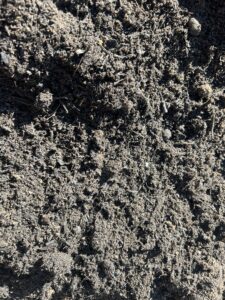 Top Dressing vs Turf Underlay Organic Top Dressing – close-up of fine loose material