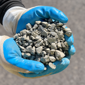 10mm Blue Metal held in blue and white gloves