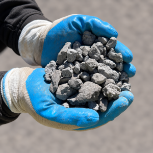 20mm Shadow Stone held in blue and white gloves
